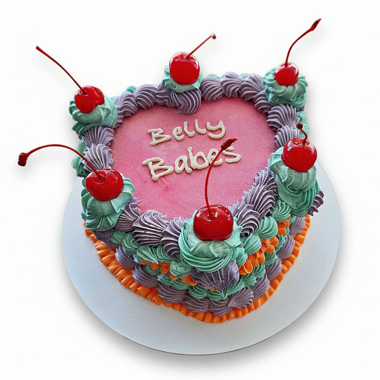 Belly Babes candy pink heart vintage cakette with lavender, turquoise and orange buttercream detailing. Created by Perth Cake and Cookie Co