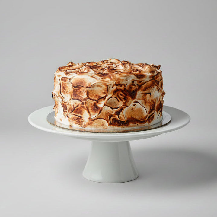 Lemon Cake with lemon curd filling and coated with toasted swiss meringue