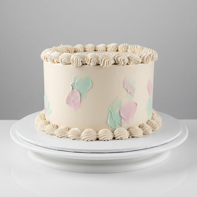 8" Gender Reveal Cakette by Perth Cake and Cookie Co. White cake with blue and pink accents